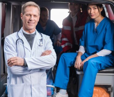 ambulance doctors working team looking at camera