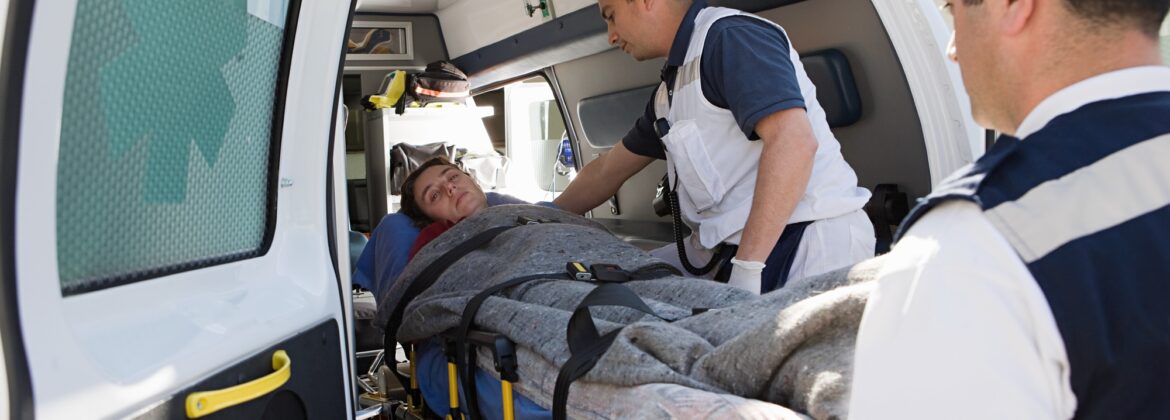 Ambulance staff and patient on stretcher