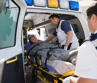 Ambulance staff and patient on stretcher