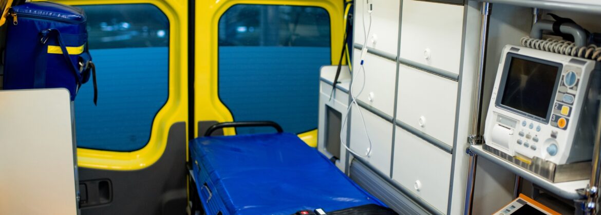 Interior of ambulance car with stretcher, refrigerator and medical equipment