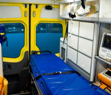 Interior of ambulance car with stretcher, refrigerator and medical equipment
